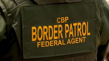 Rücken eines Grenzpolizisten