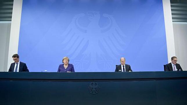 Ministerpräsidenten mit Bundeskanzlerin Angela Merkel und dem designierten Bundeskanzler Olaf Scholz.