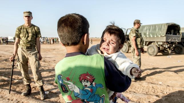 Bild: pa Syrische Flüchtlingskinder an der Grenze zur Türkei