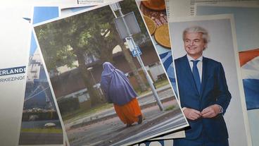 Ein Bild von Geert Wilders liegt neben einem Bild einer verhüllten Frau.