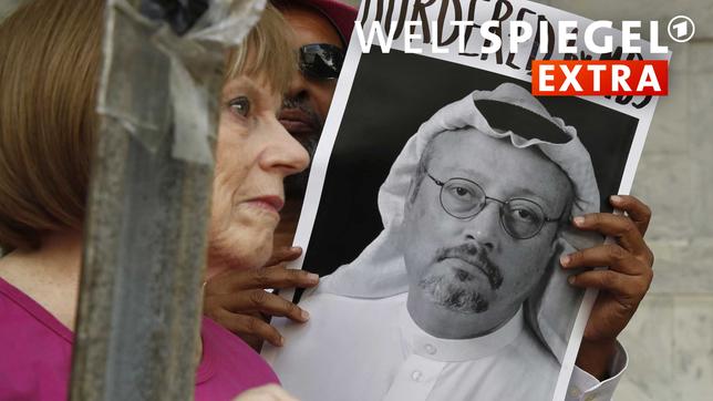 Demonstranten halten Plakate mit dem Bild des in der Türkei getöteten Journalisten Jamal Khashoggi