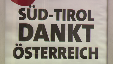 Schild mit Aufschrift: Süd-Tirol dankt Österreich