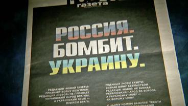 Zeitungsschlagzeile "Russland bombardiert die Ukraine"