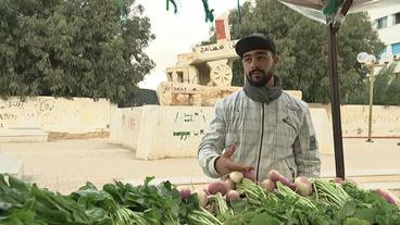 Gemüsehändler Majdeddine Badri an seinem Verkaufsstand