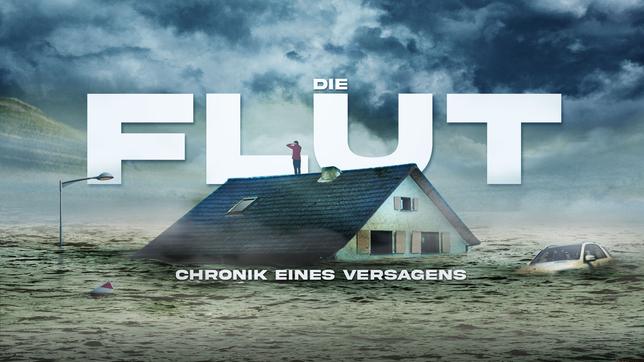 Mann steht auf dem Dach eines Hauses, dass im Wasser versunken ist.