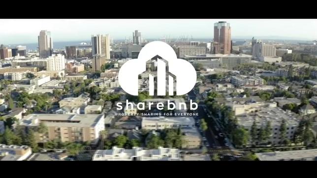 Eine Großstadt ist aus der Luft zu sehen. Darauf abgebildet ist das Logo von Share BNB.