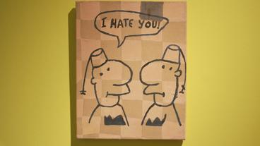 Karikatur zweier Männer, einer sagt "I hate you" zum anderen