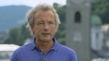 Bild: BR Ein mittelalter Mann mit Brille gibt ein Fernsehinterview