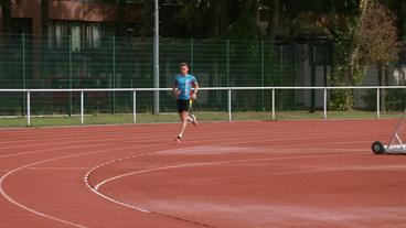 Sportler auf der Tartanbahn