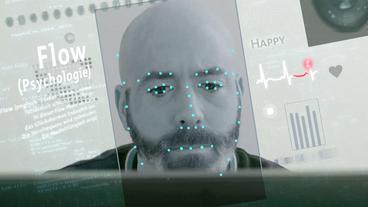 Das Gesicht eines Mannes mit Messpunkten auf einem Computerbildschirm