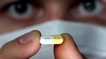 Bild: dpa Eine Tamiflu-Kapsel
