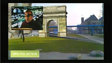 Szene aus Computerspiel: Virtueller Torbogen erscheint auf Wiese am Rheinufer, links oben im Bild: Virtueller Spielleiter