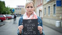 Stars der Lindenstraße mit Schild "Bring back Our Girls"