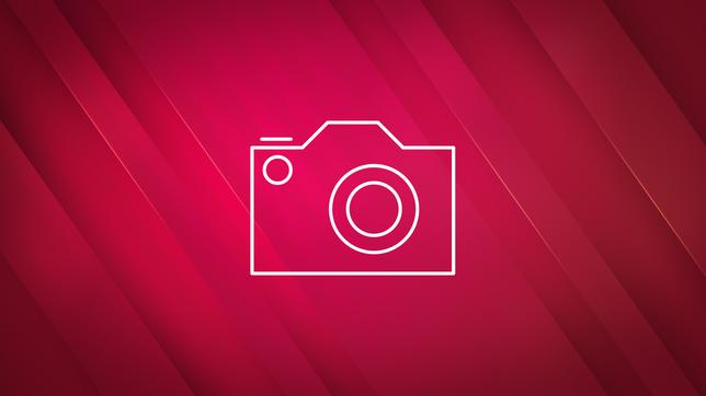 Weißes Kamera-Icon vor pinkem Hintergrund